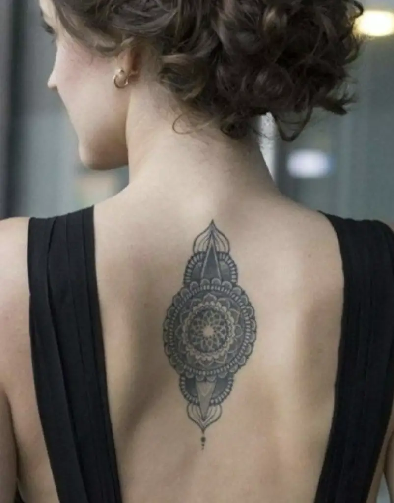 Women Upper Back Tattoo