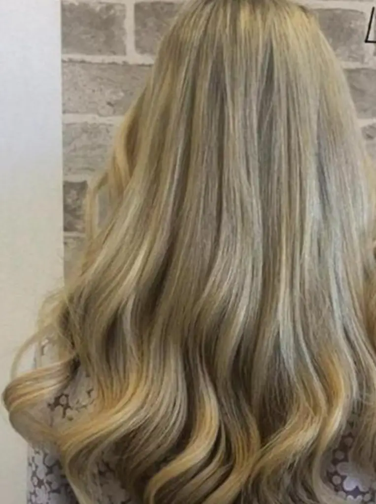 Weaved Platinum Blonde Hairstyle with a Twist